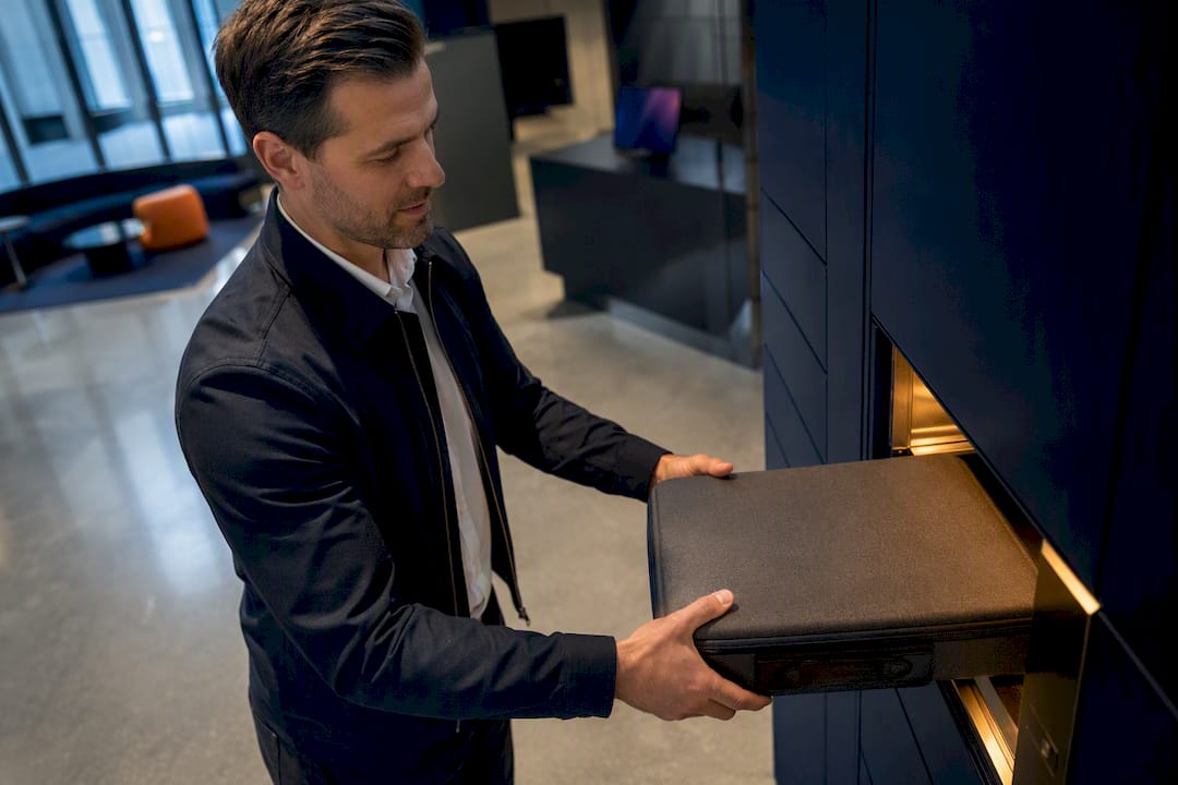 Employee retrieving equipment from secure fulfilment cabinet