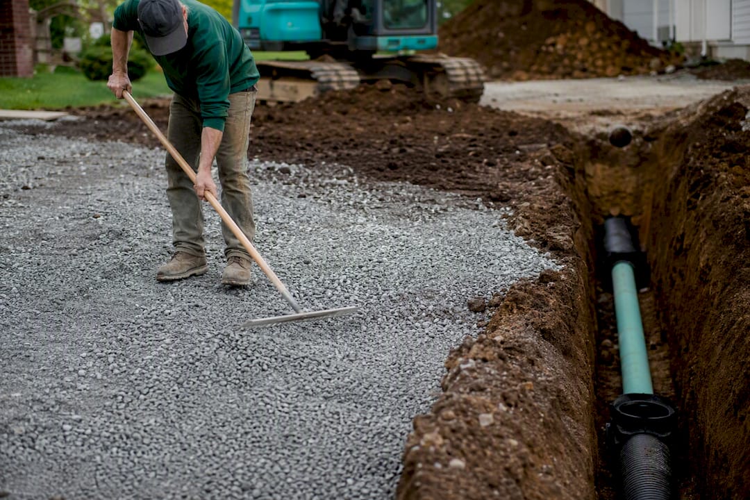 Site grading and drainage setup for a backyard court