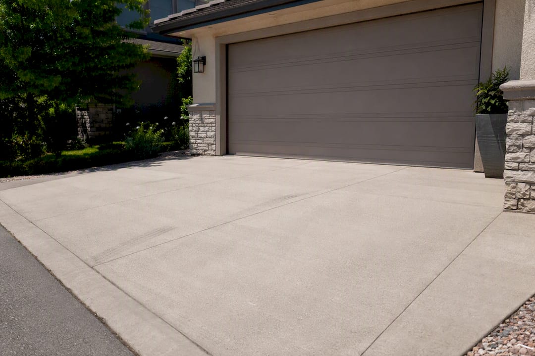 Concrete driveway apron in front of garage