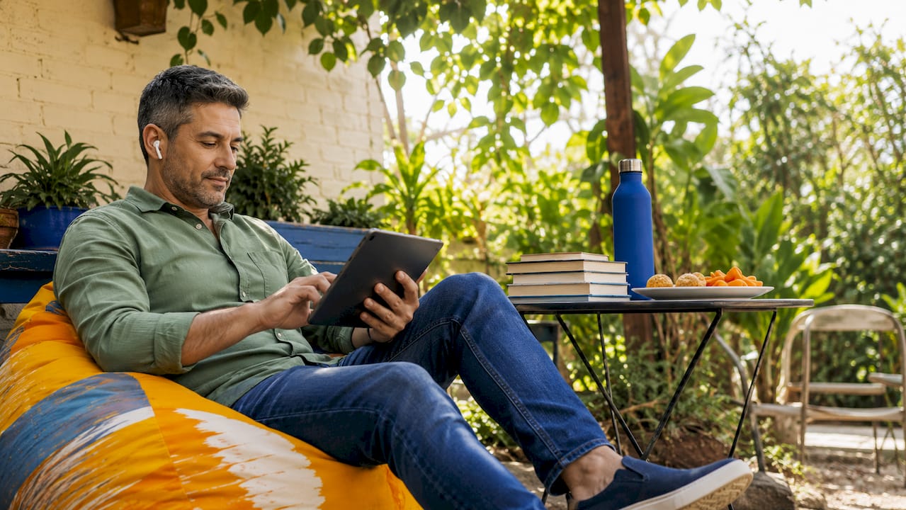 Man browsing marketing content on tablet