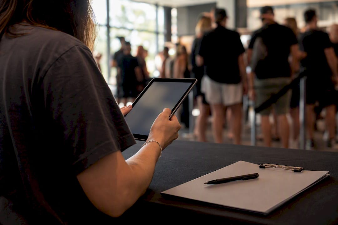 Staff doing manual attendee lookup on device