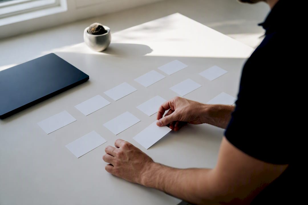 Hands organizing cards to reconstruct ownership