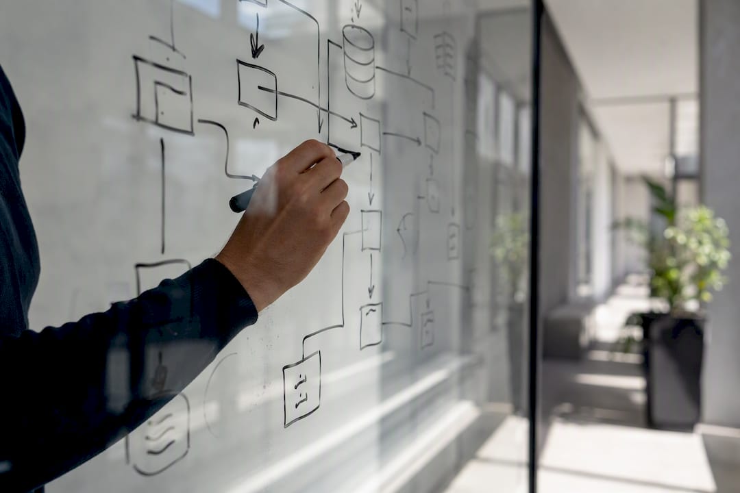 Engineer hand pointing at data format diagrams