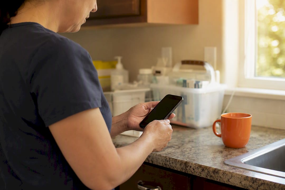 Caregiver preparing to log EVV visit start