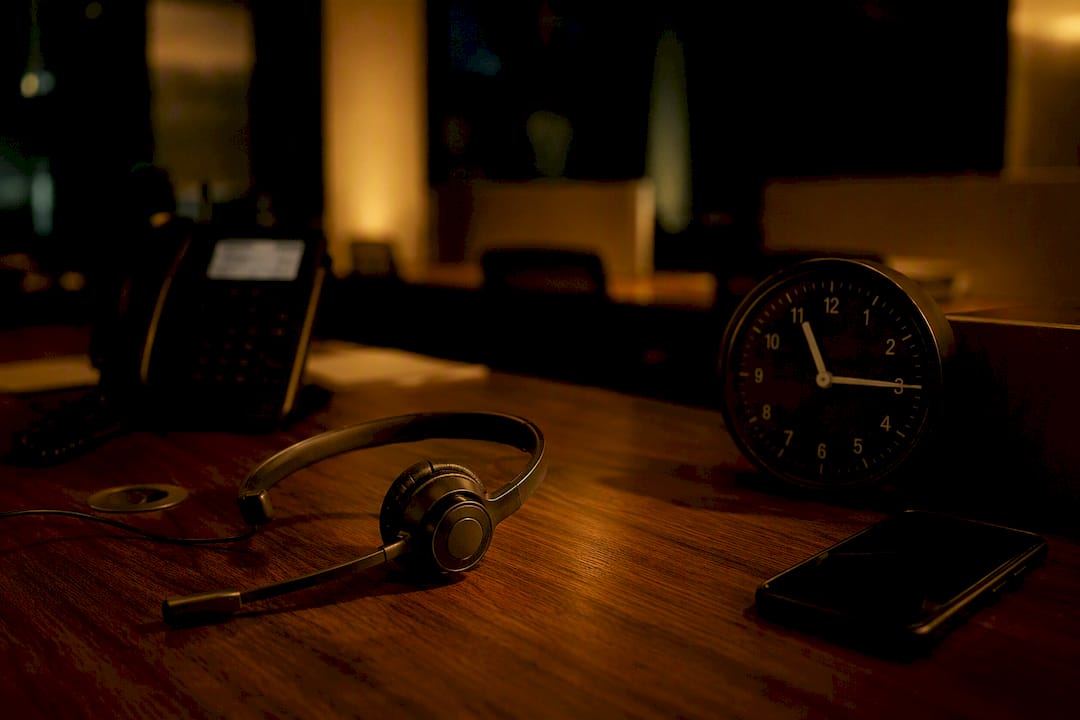 Headset and phone at calm after-hours desk