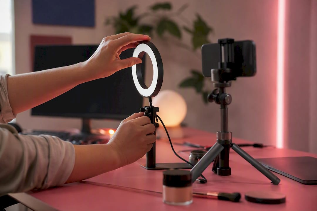 Hands adjusting lights for product demo video