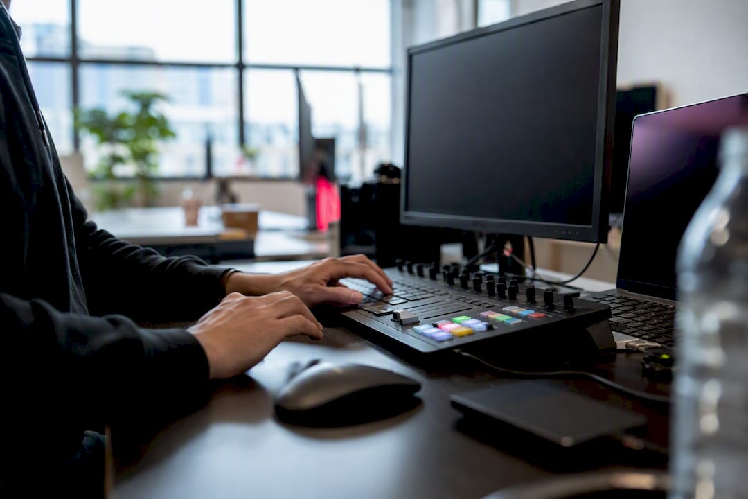 Hands controlling video editing workflow