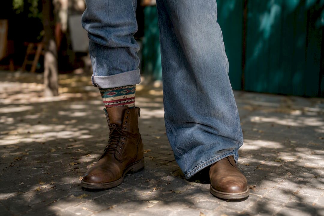 Side by side tucking styles with brown combat boots and denim