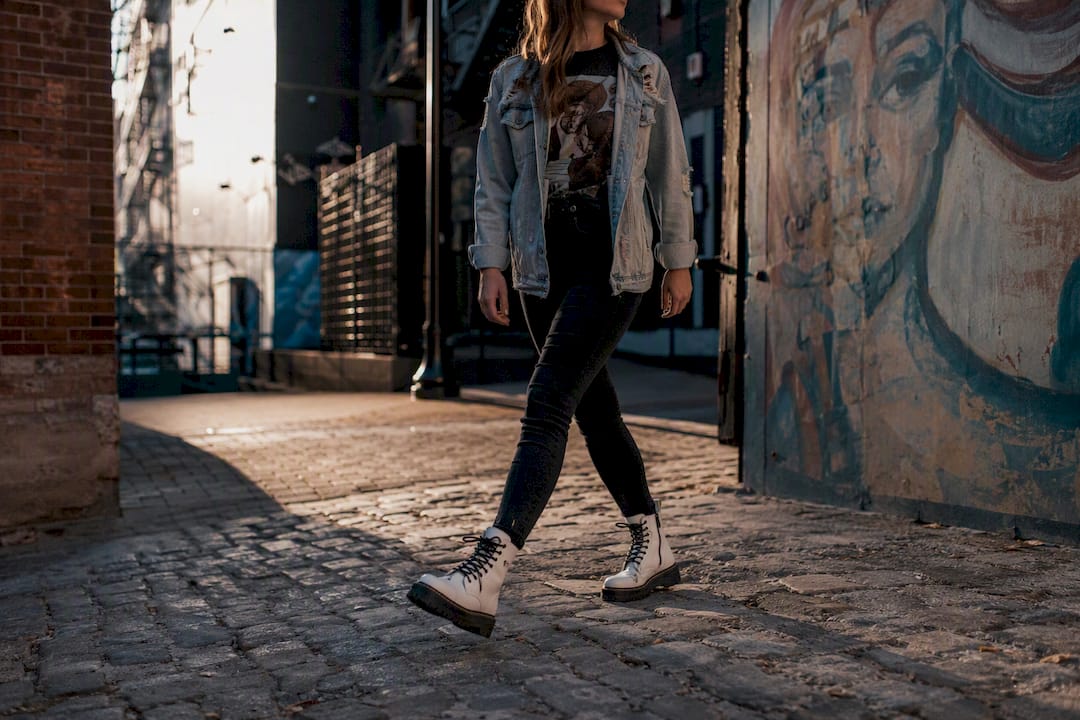 Grunge style leather jacket, denim and white boots
