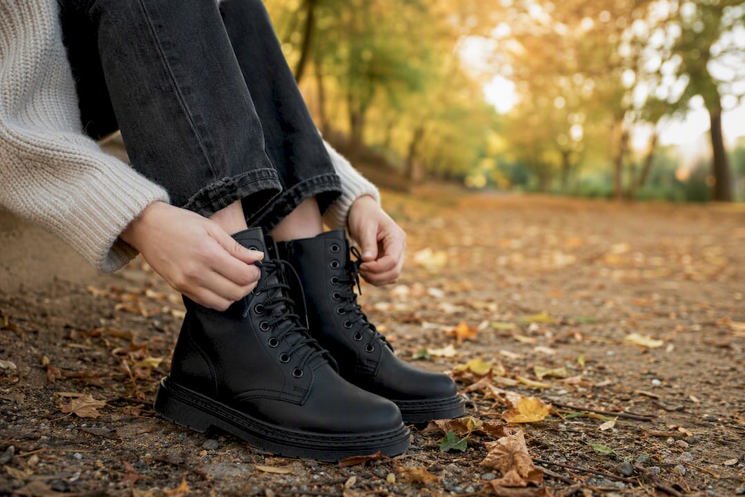 Hands lacing vegan combat boots