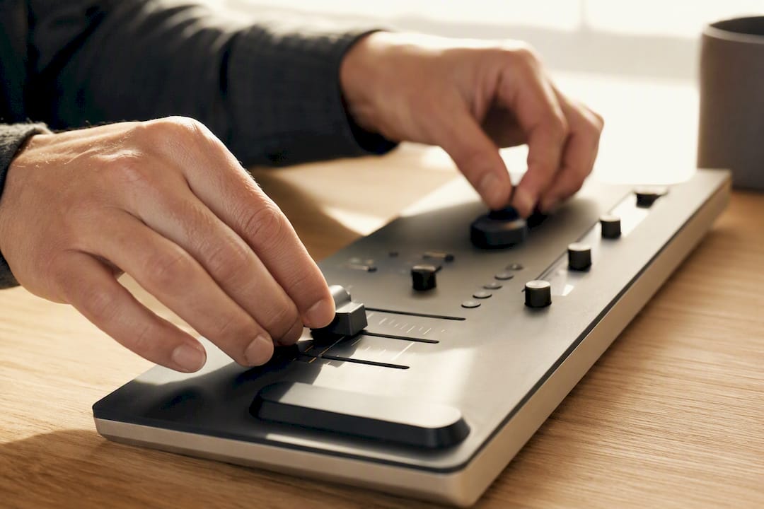 Hands performing manual intervention on control interface