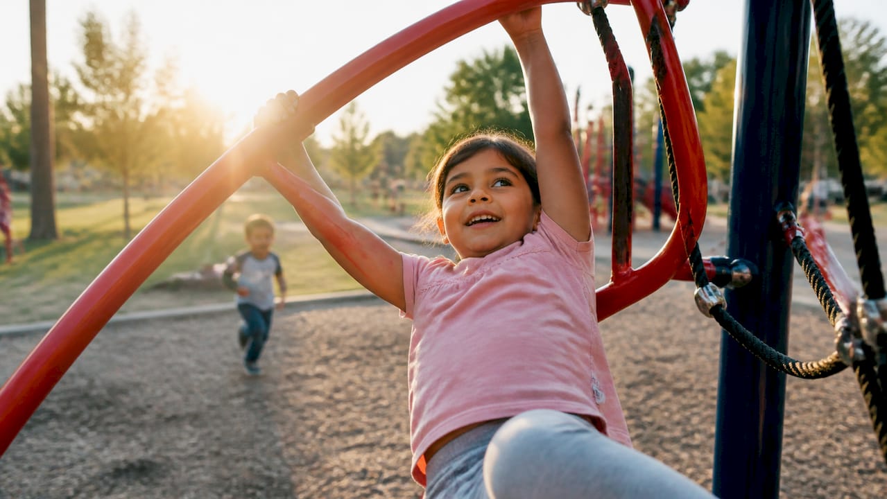 Child playing energetically on playground