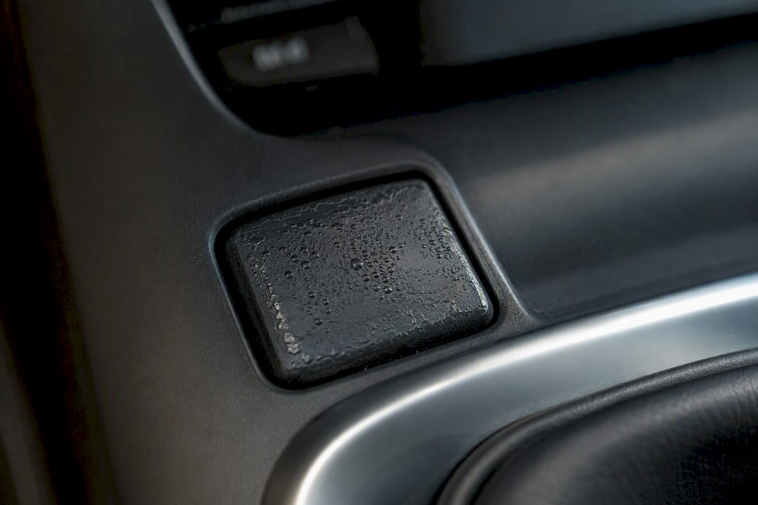 Close-up of degraded soft-touch car button surface