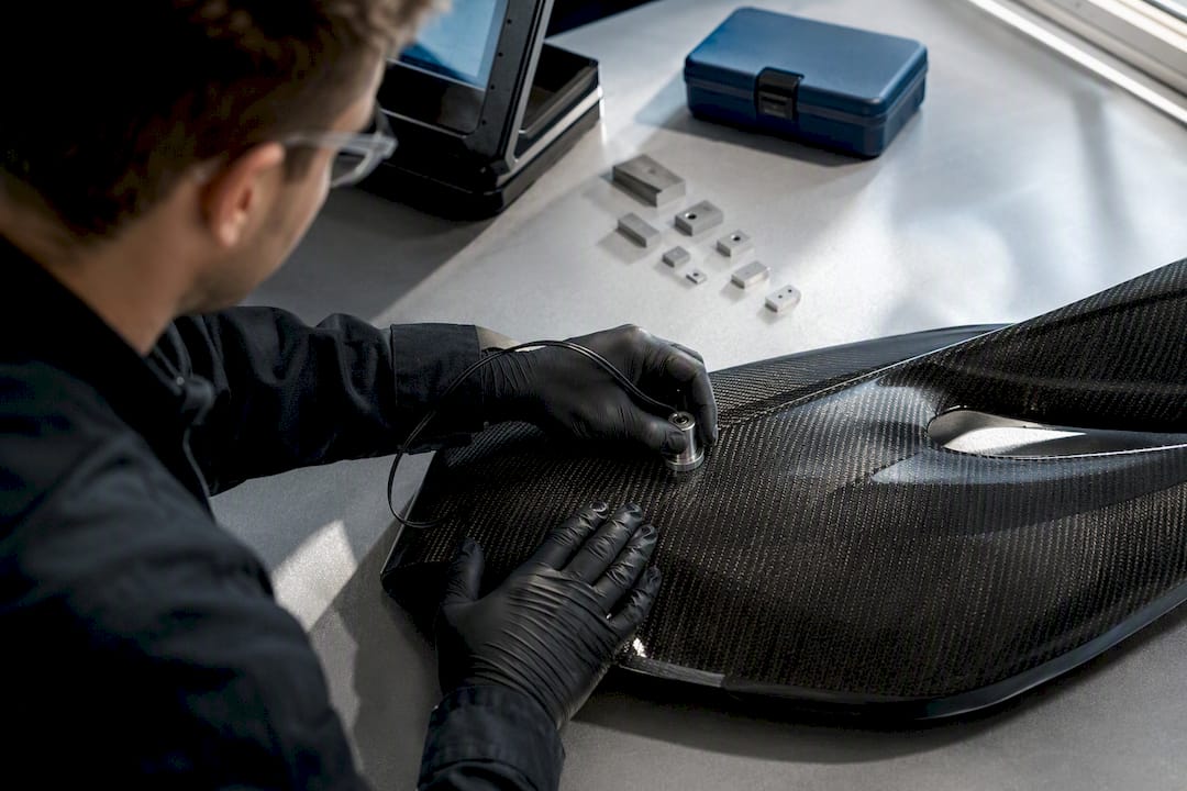 Ultrasonic probe inspecting carbon fiber panel