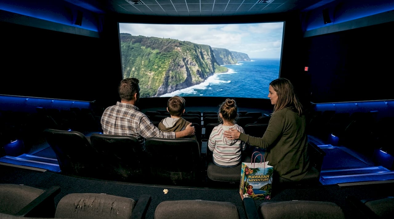 Family enjoying immersive Hawaii ride theater