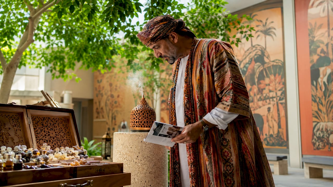 Visitor engaging with cultural scent exhibit