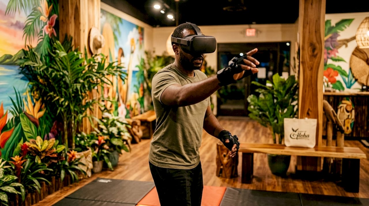 Man engaging in free-roam VR arena interaction