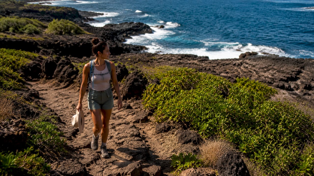 Hiker on coastal trail at Kaloko-Honokōhau park