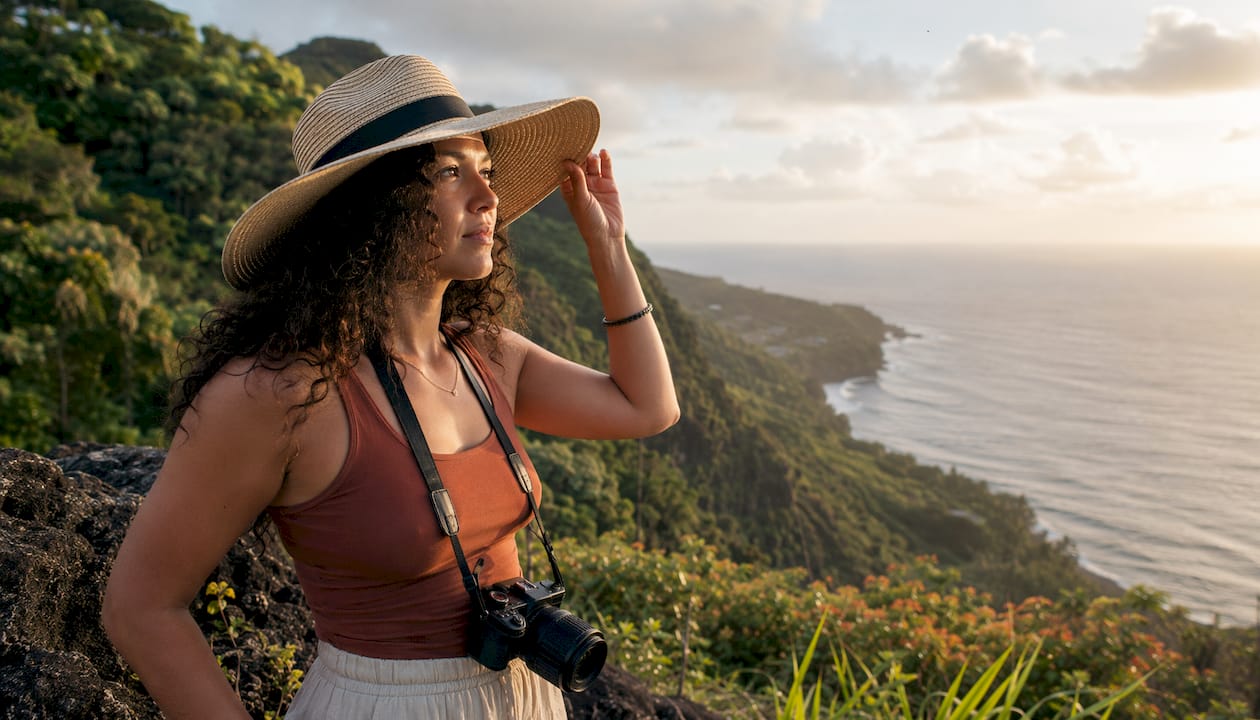 Woman at Hawaii lookout point with camera