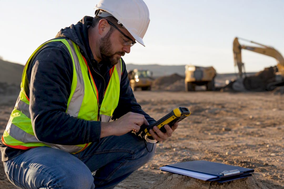 GPS device and safety paperwork on construction beam