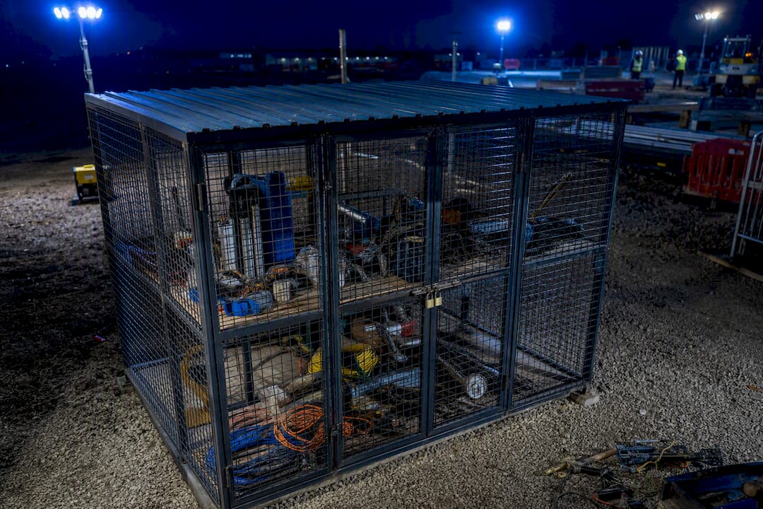 Locked tool cage lit by security lights