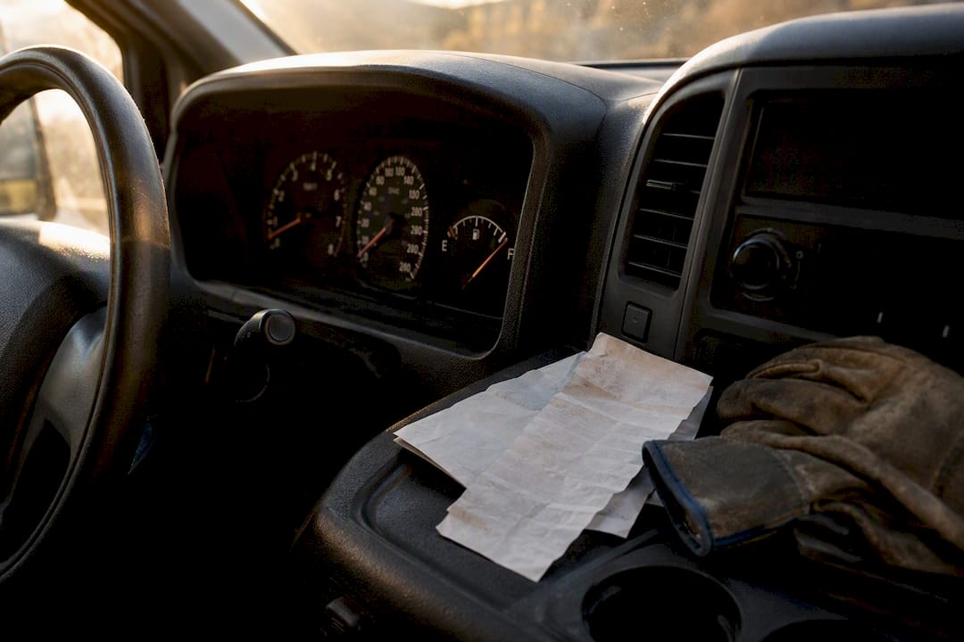 Dashboard and fuel receipt inside company vehicle