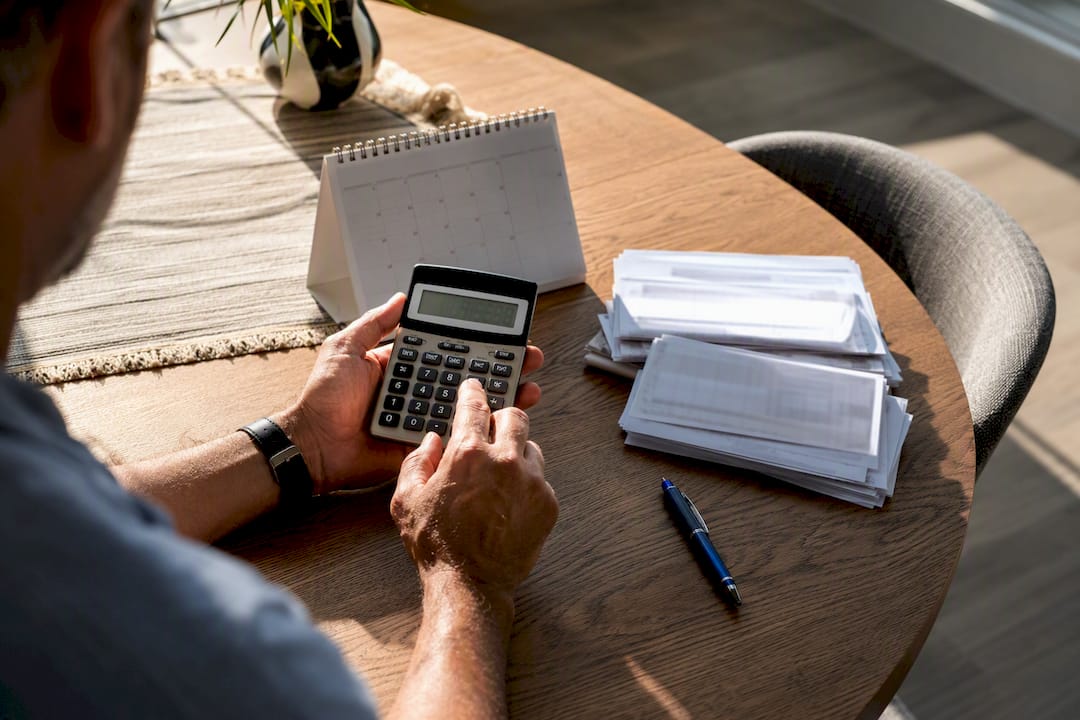 Worker estimating compensation benefits at home