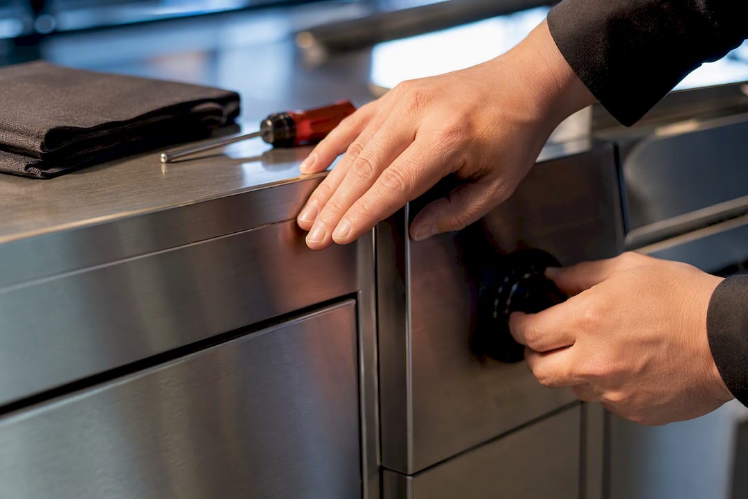 Buyer checking stainless equipment build quality