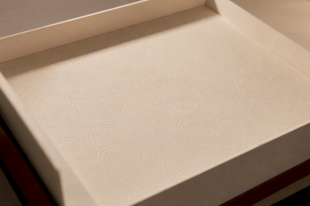 Close-up of debossed design inside luxury box