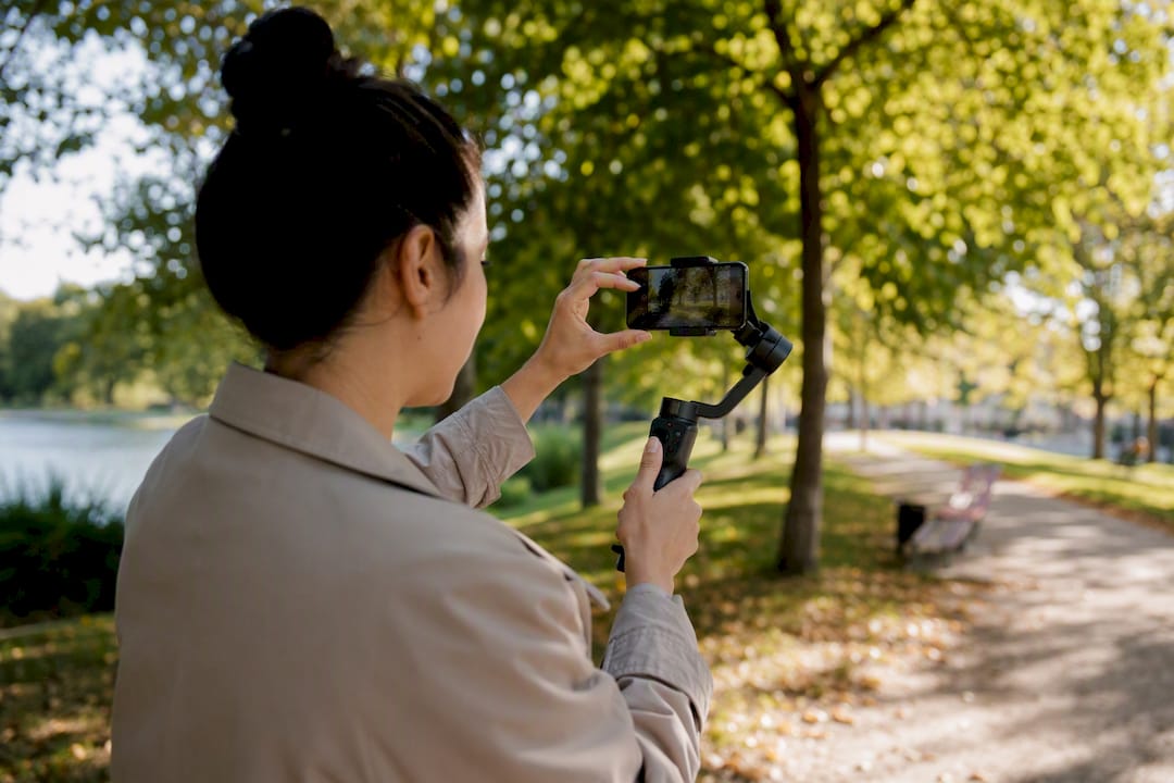 Hands filming social media video with smartphone