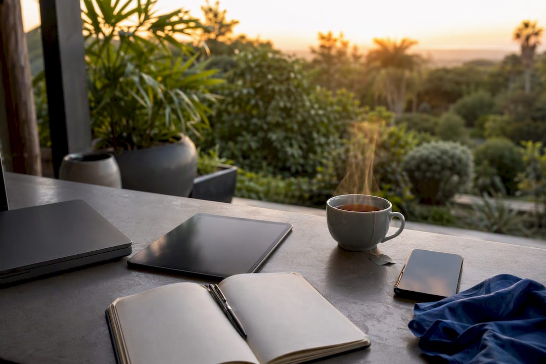 Minimalist ad creative workspace with devices and notebook
