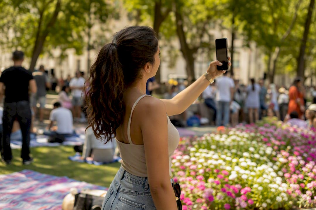 Hand holding smartphone recording an e-commerce reel