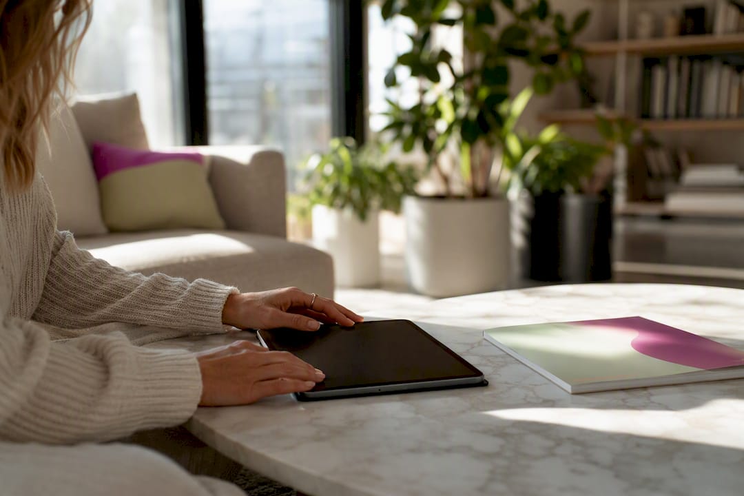 Hands scheduling social media posts on phone
