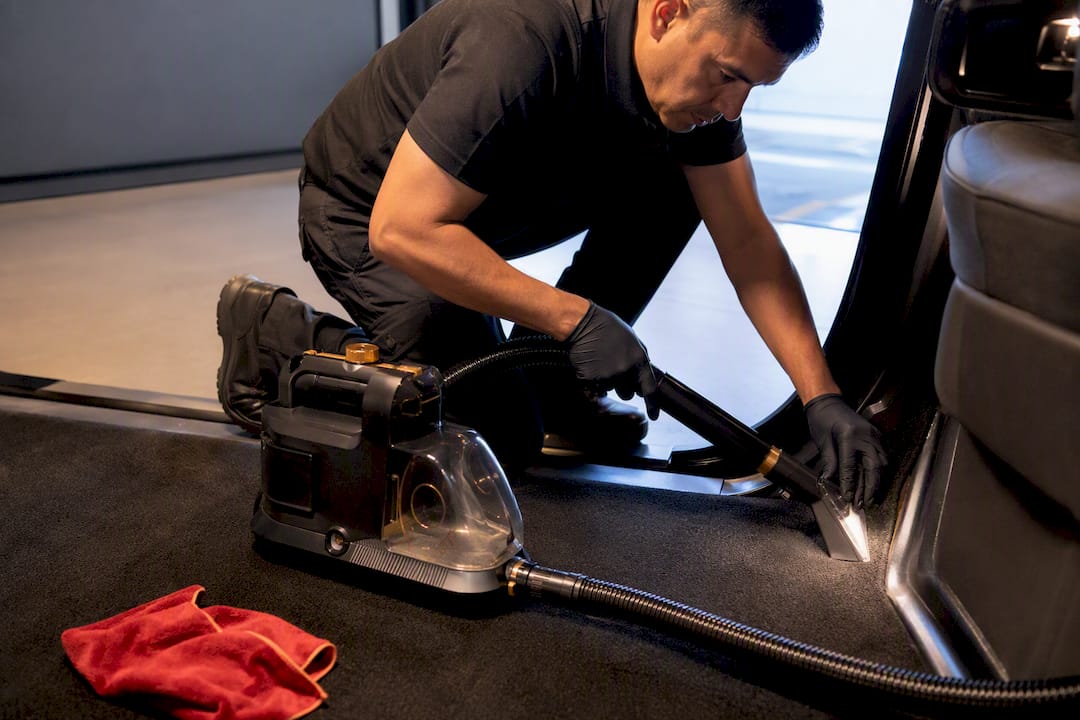 Technician removing car mold with HEPA and steam