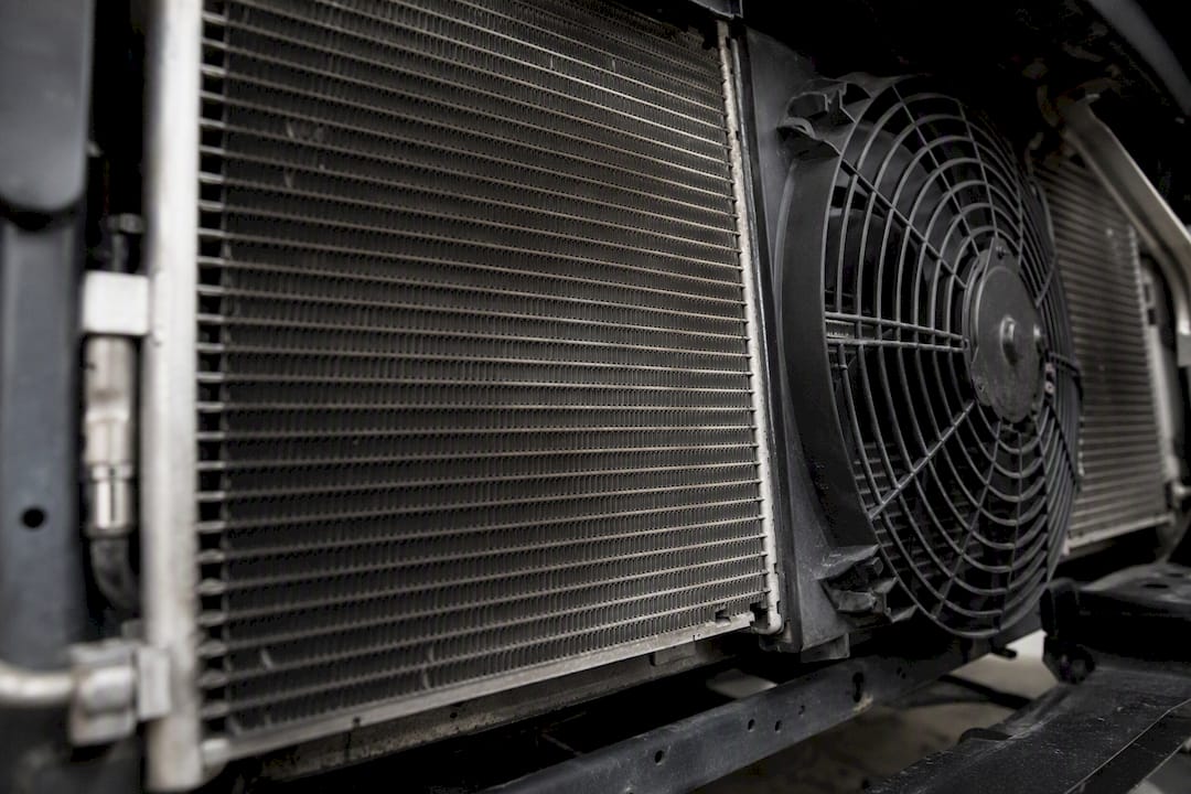 Close-up view of car condenser and cooling fan