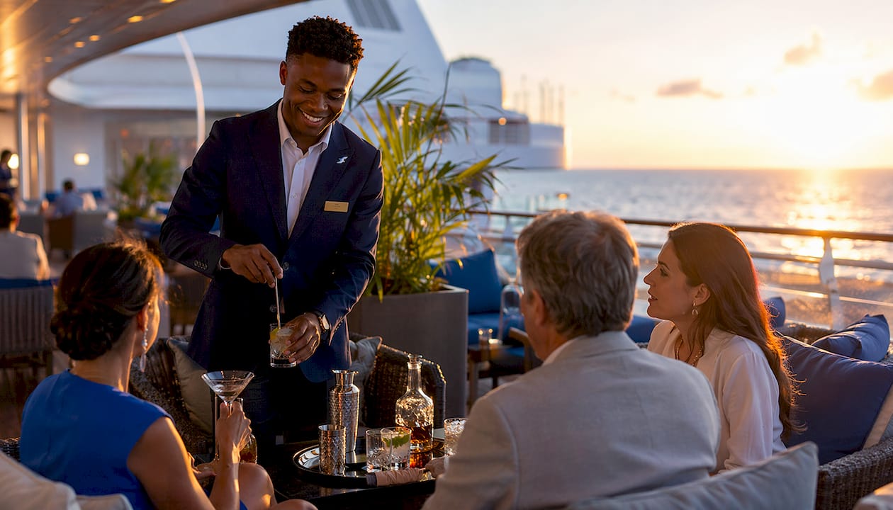 Concierge serving and chatting in lounge