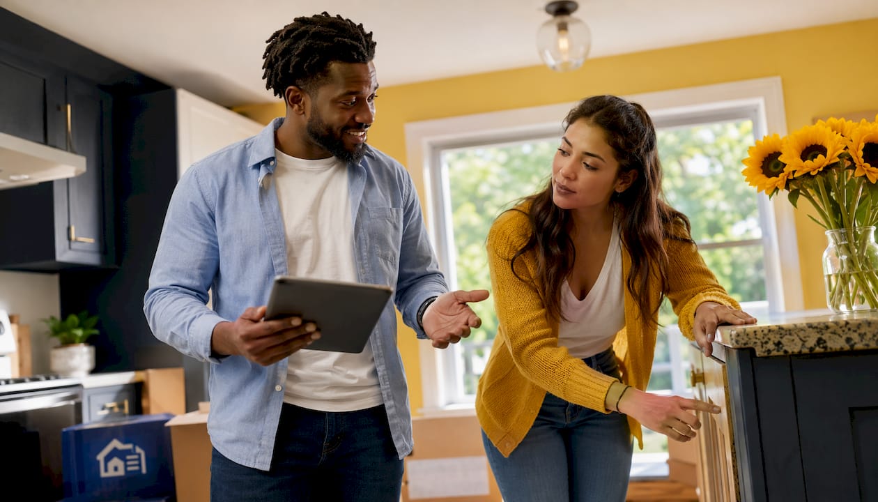 Landlord and tenant discussing move-in walkthrough