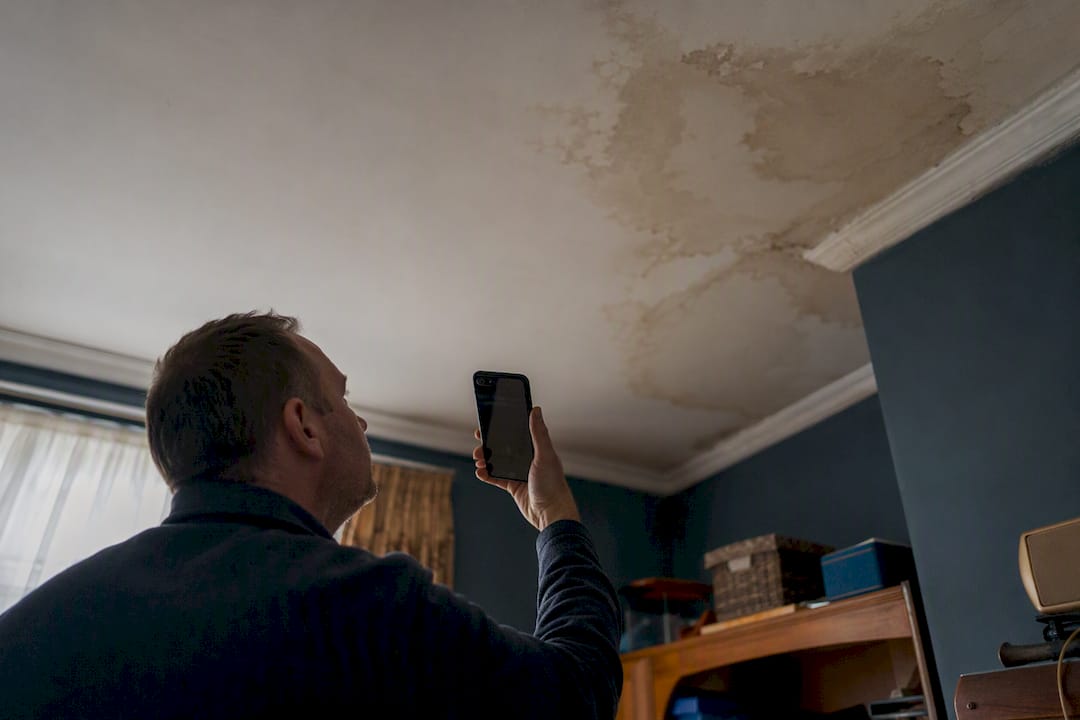 Landlord photographing rental damage