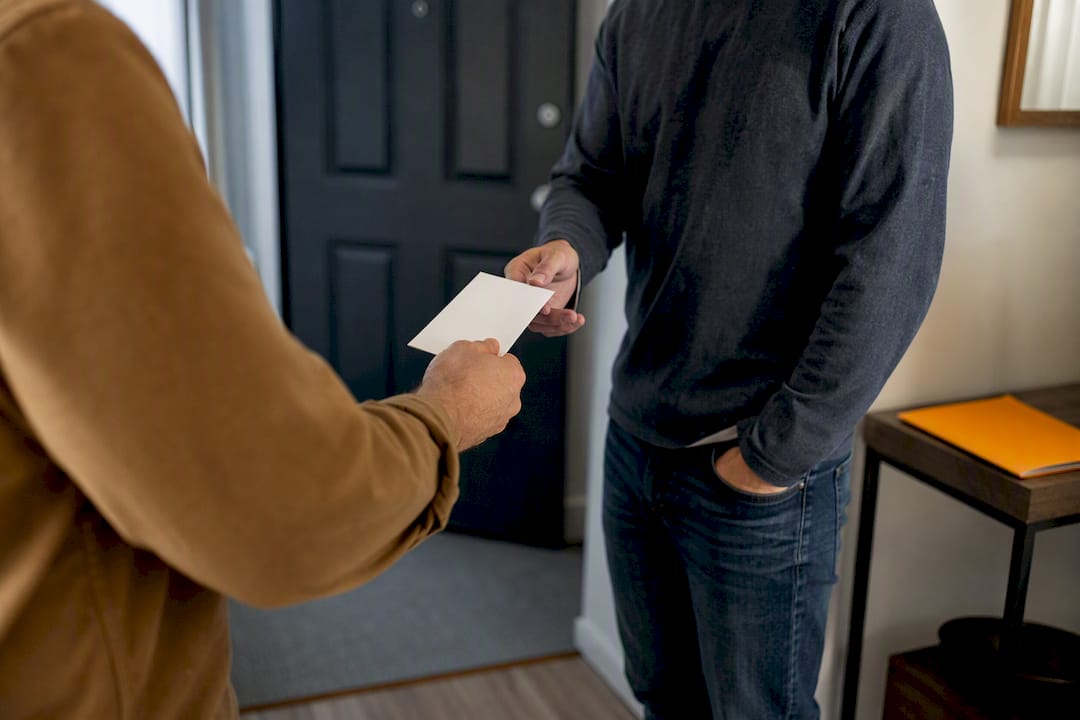 Rent payment exchanged outside rental apartment
