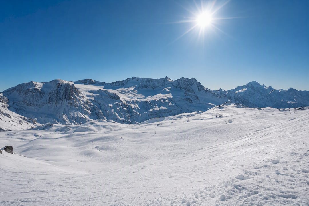 Sunny glacier ski slopes at Les Deux Alpes