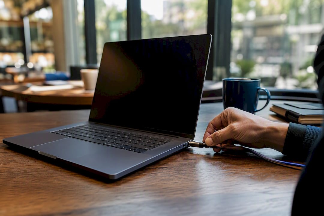 Hand setting up CRM to Facebook ad integration