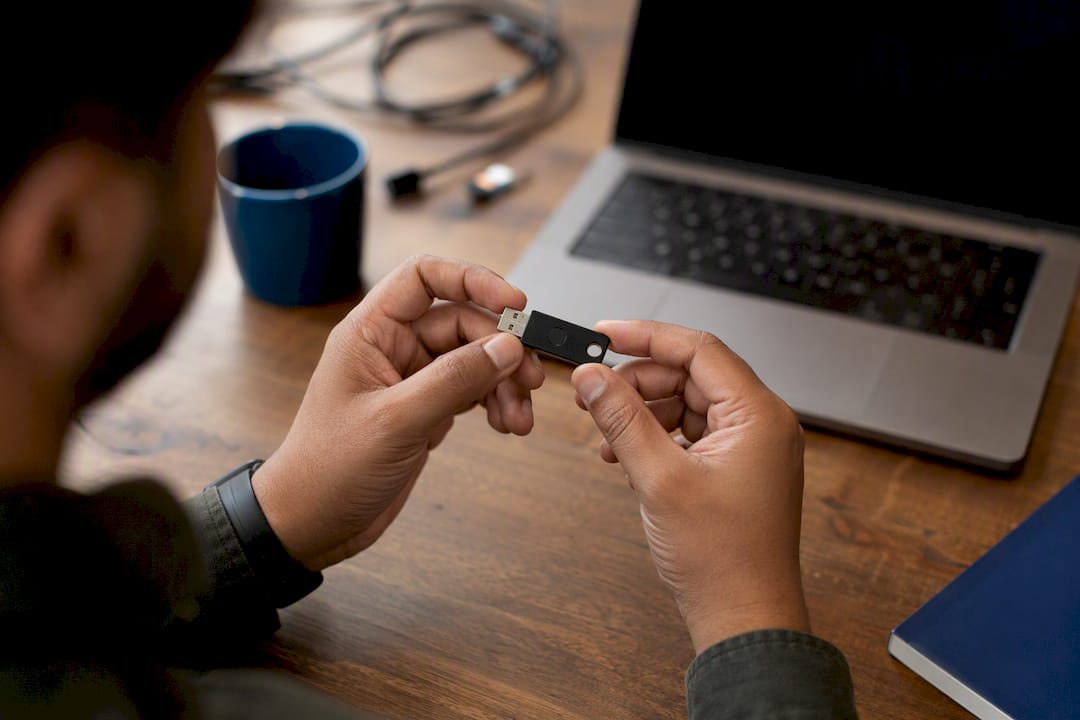 Hands inspecting website security device