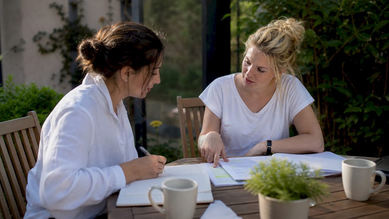 Two ESL teachers discussing lesson plans