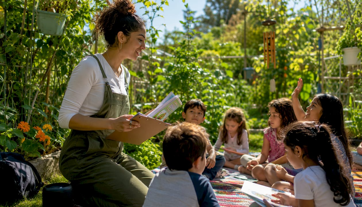 Teacher leading outdoor summer ESL camp activity