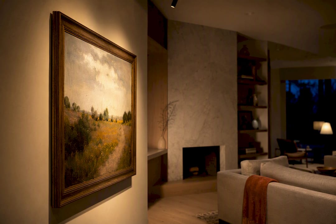 Framed painting illuminated in warm living room