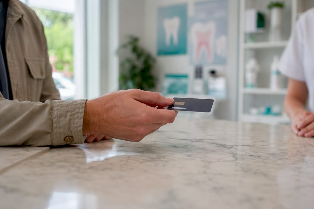Patient paying at dental clinic counter