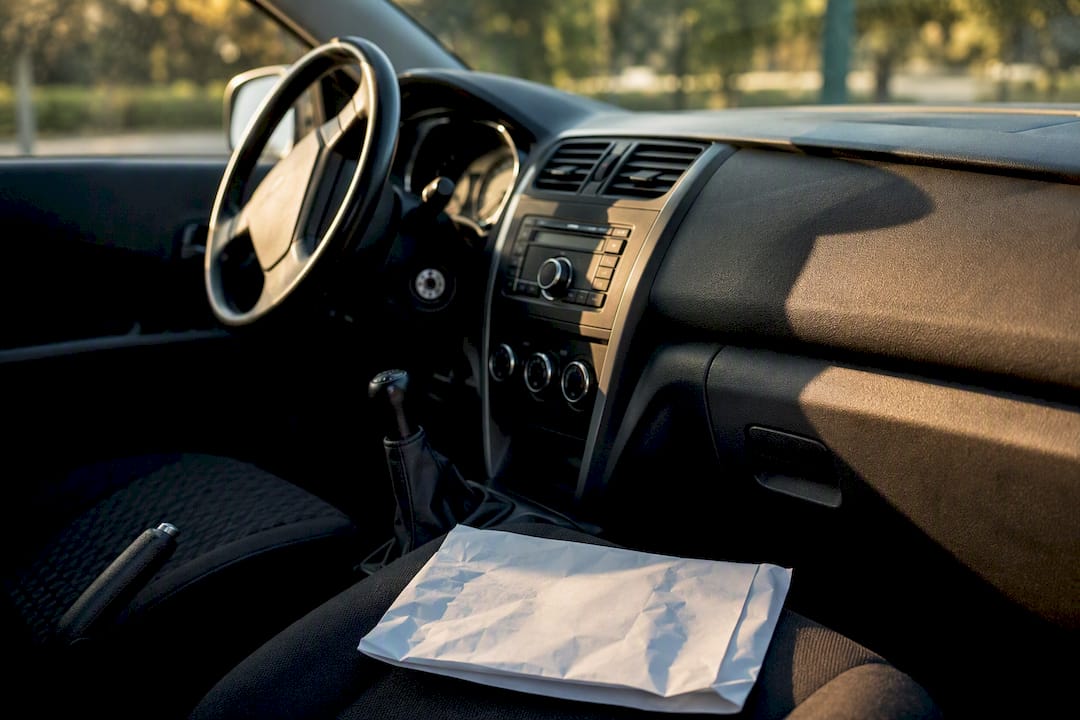 Car interior dashboard with insurance policy