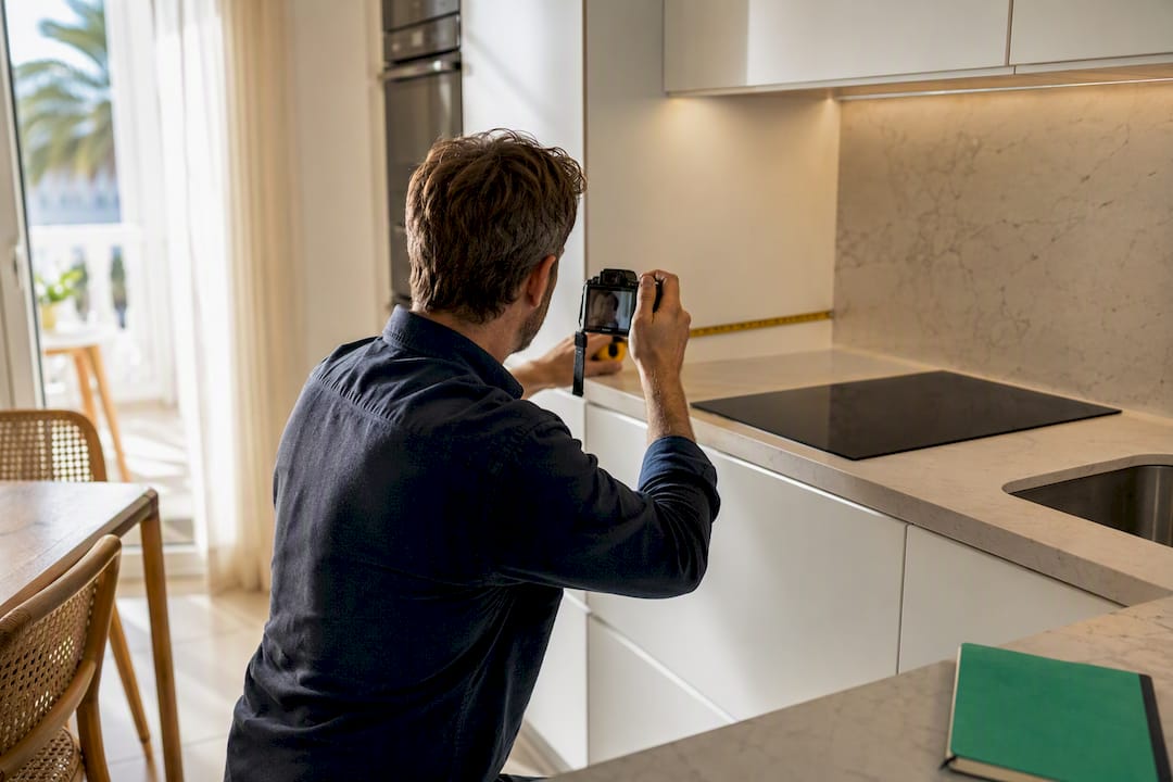 Claims assessor documenting apartment fixtures