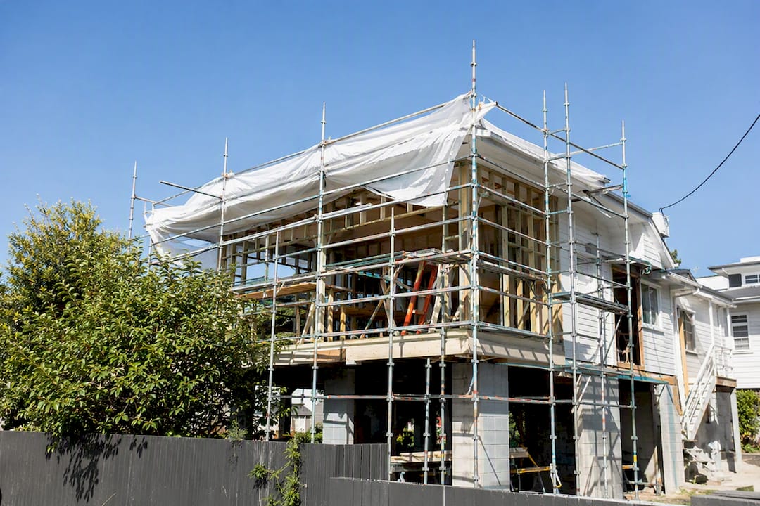 Scaffolding and temporary roof on house extension