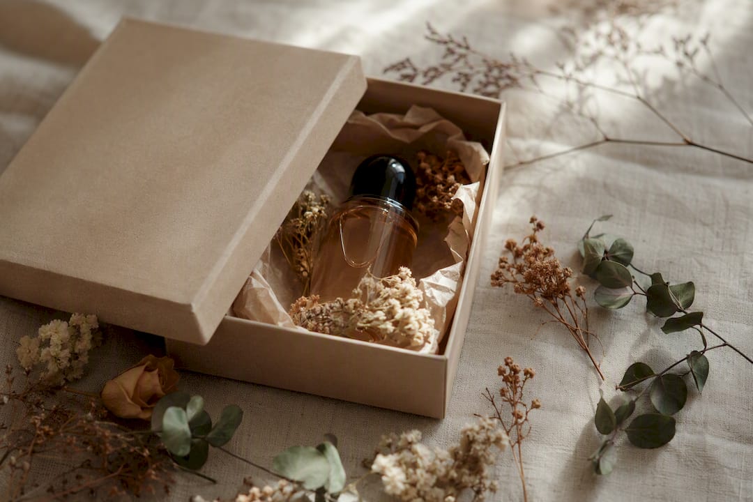 Elegant natural perfume gift box, flat lay